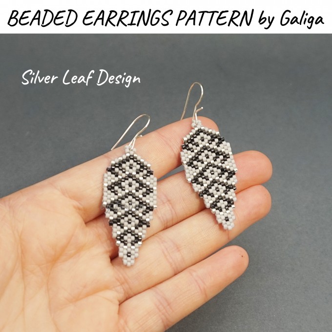 Earrings with intricate silver leaf designs created using beading techniques